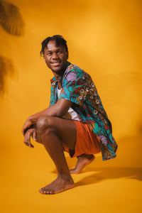 Ricardo is wearing size M printed cotton button up shirt in gray flora