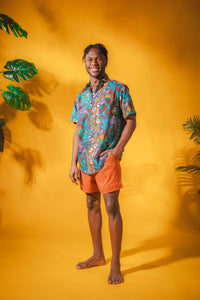 Ricardo is wearing size M printed cotton button up shirt in gray flora