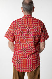 Ross is wearing size M printed cotton button up shirt in red geo