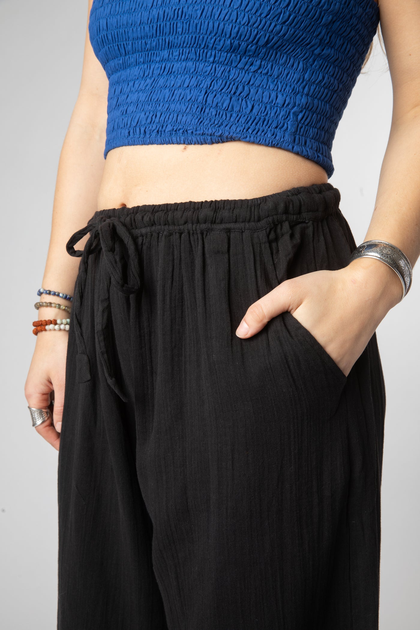 Sophie is wearing cotton pants in black