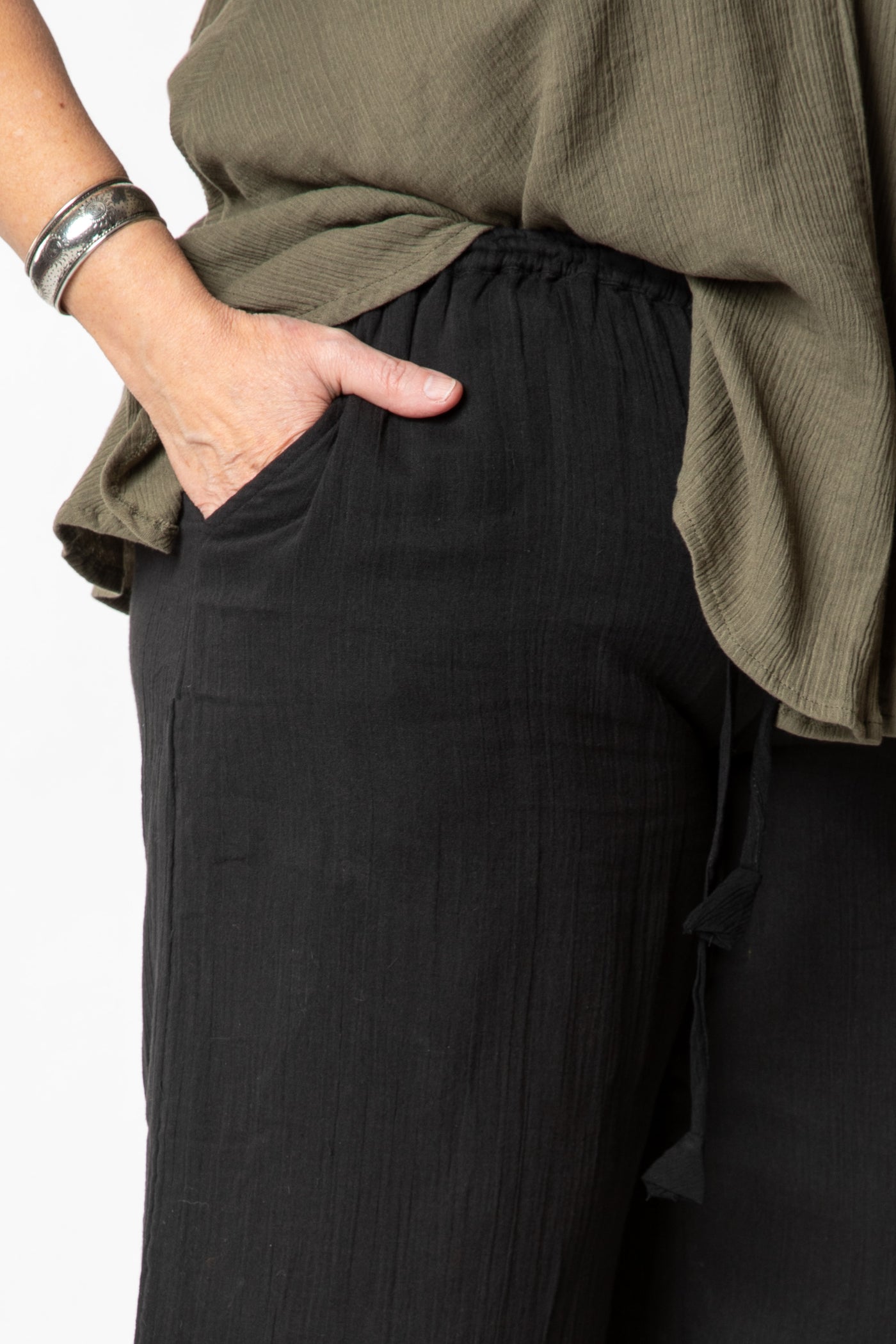 Betty is wearing cotton pants in black