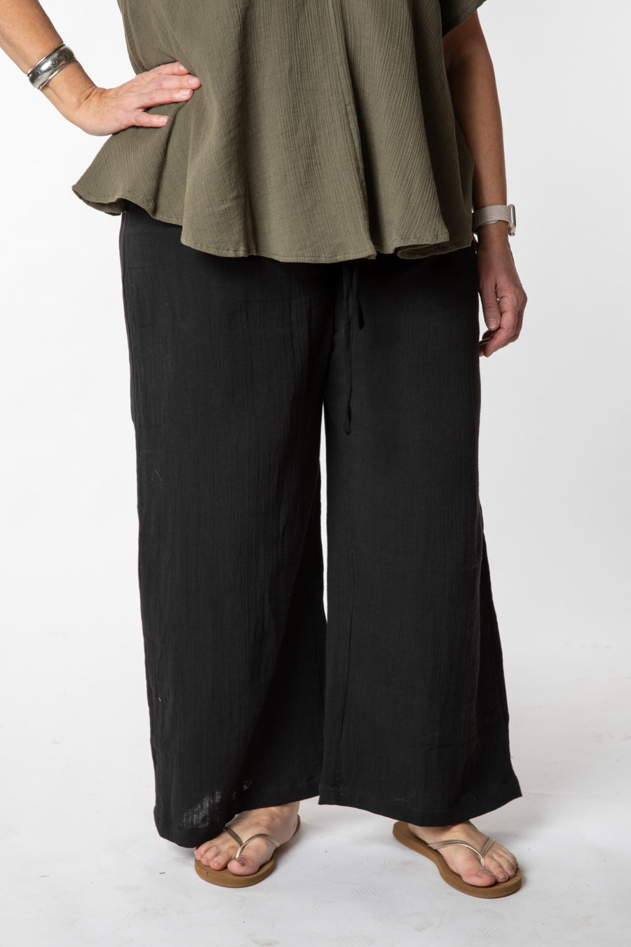 Betty is wearing cotton pants in black