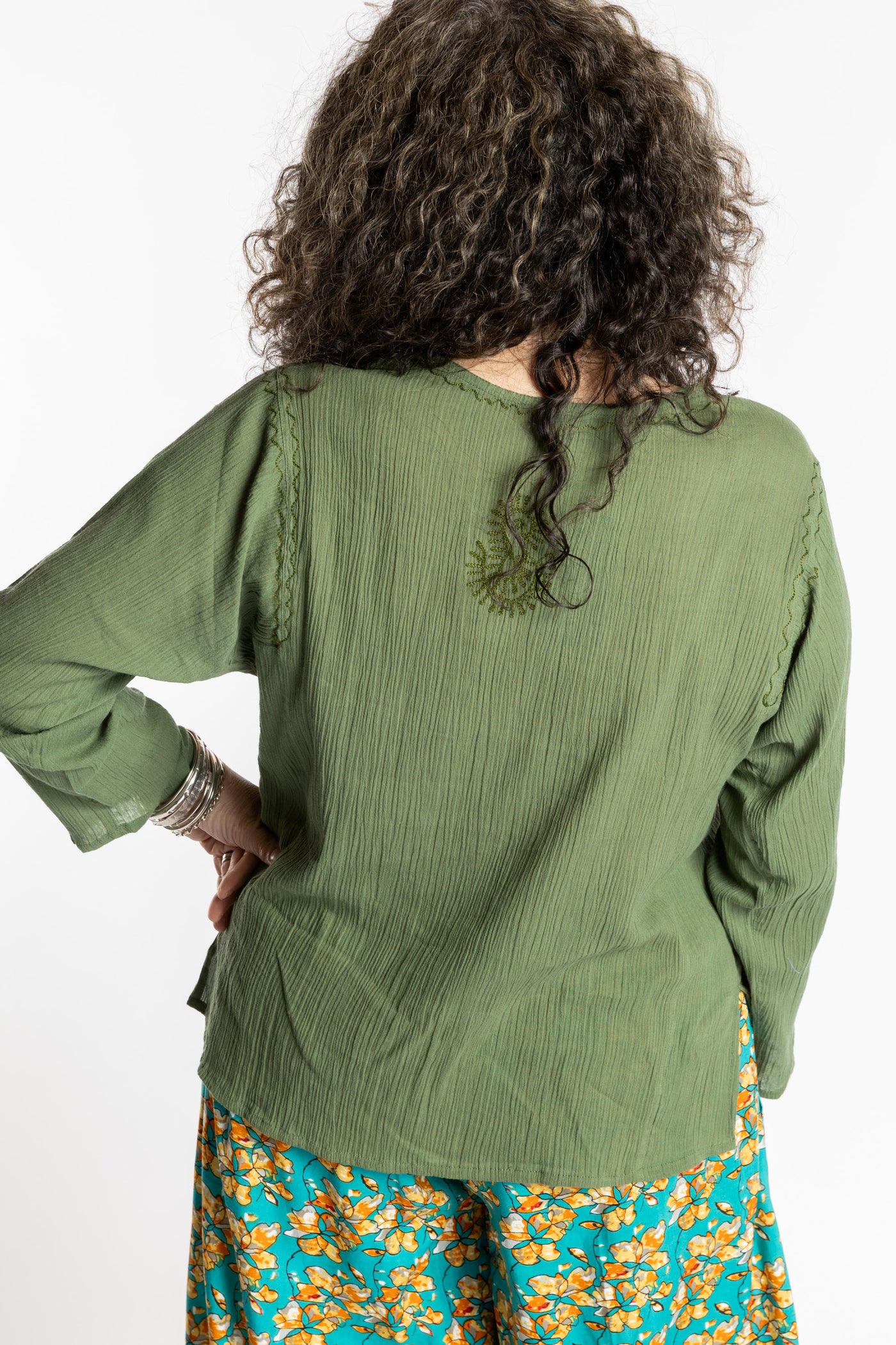 Susan is wearing the M Green Flowy Bohemian Womens Clothing Top