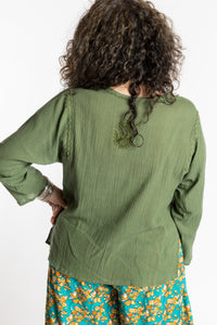 Susan is wearing the M Green Flowy Bohemian Womens Clothing Top