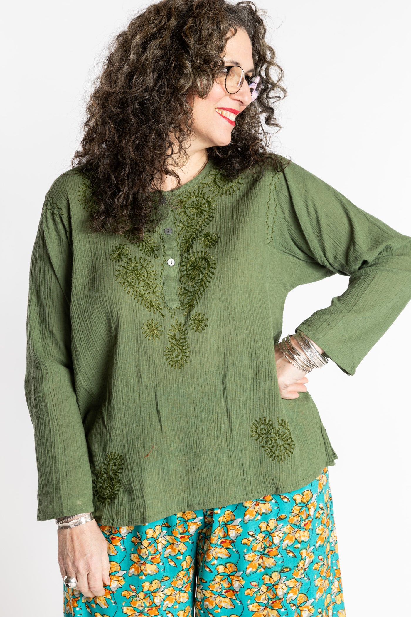 Susan is wearing the M Green Flowy Bohemian Womens Clothing Top