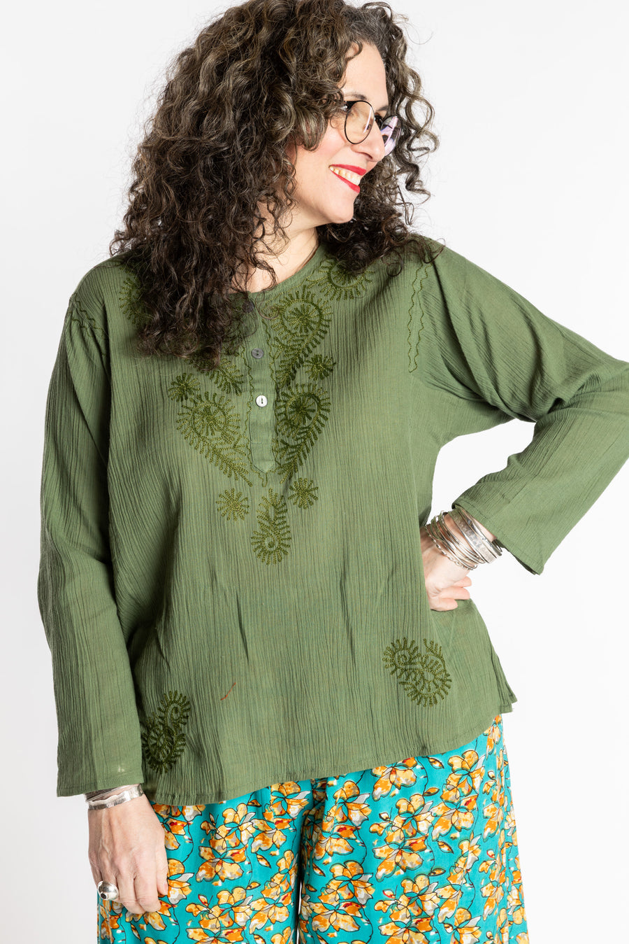 Susan is wearing the M Green Flowy Bohemian Womens Clothing Top