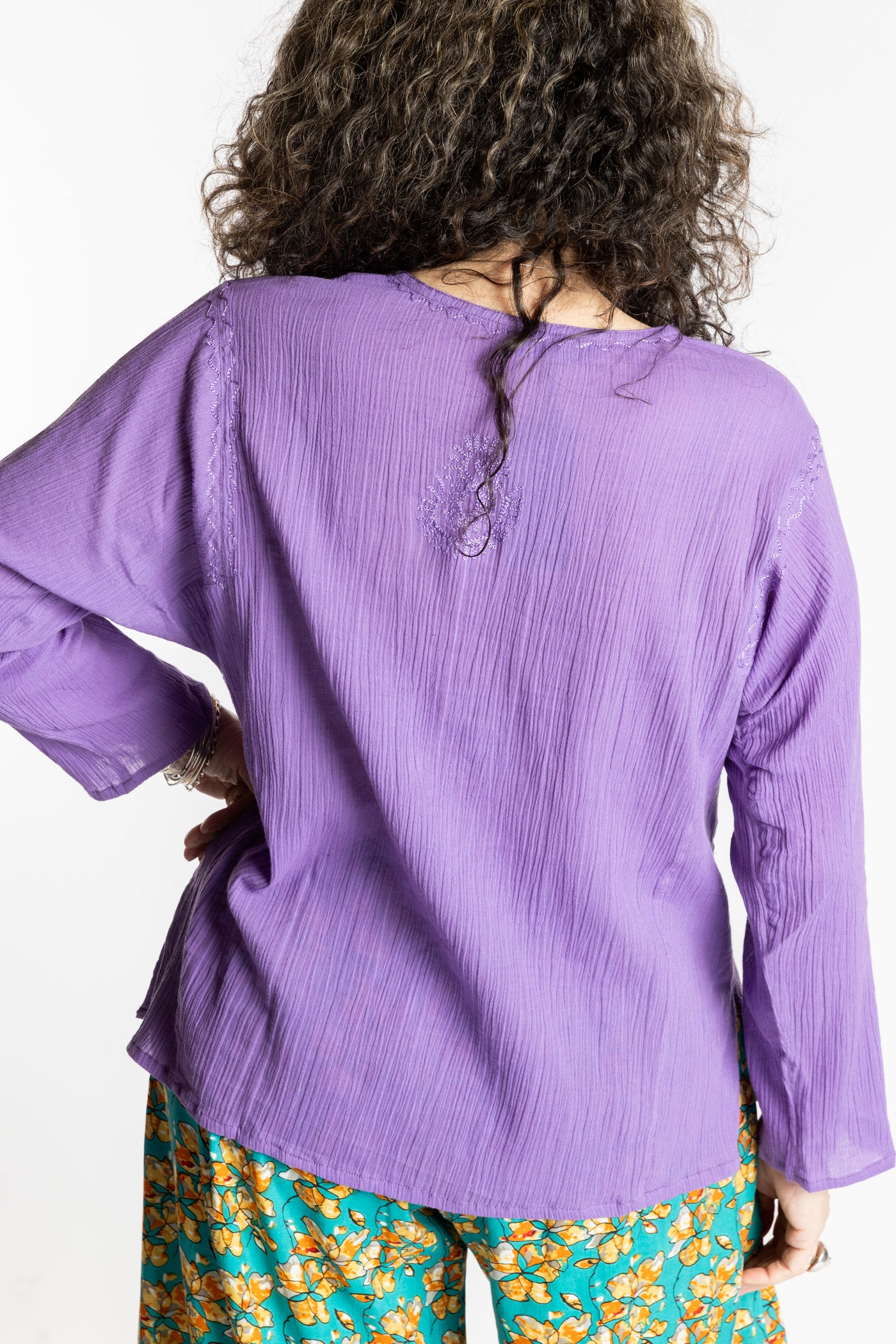 Susan is wearing the M Purple Flowy Bohemian Womens Clothing Top