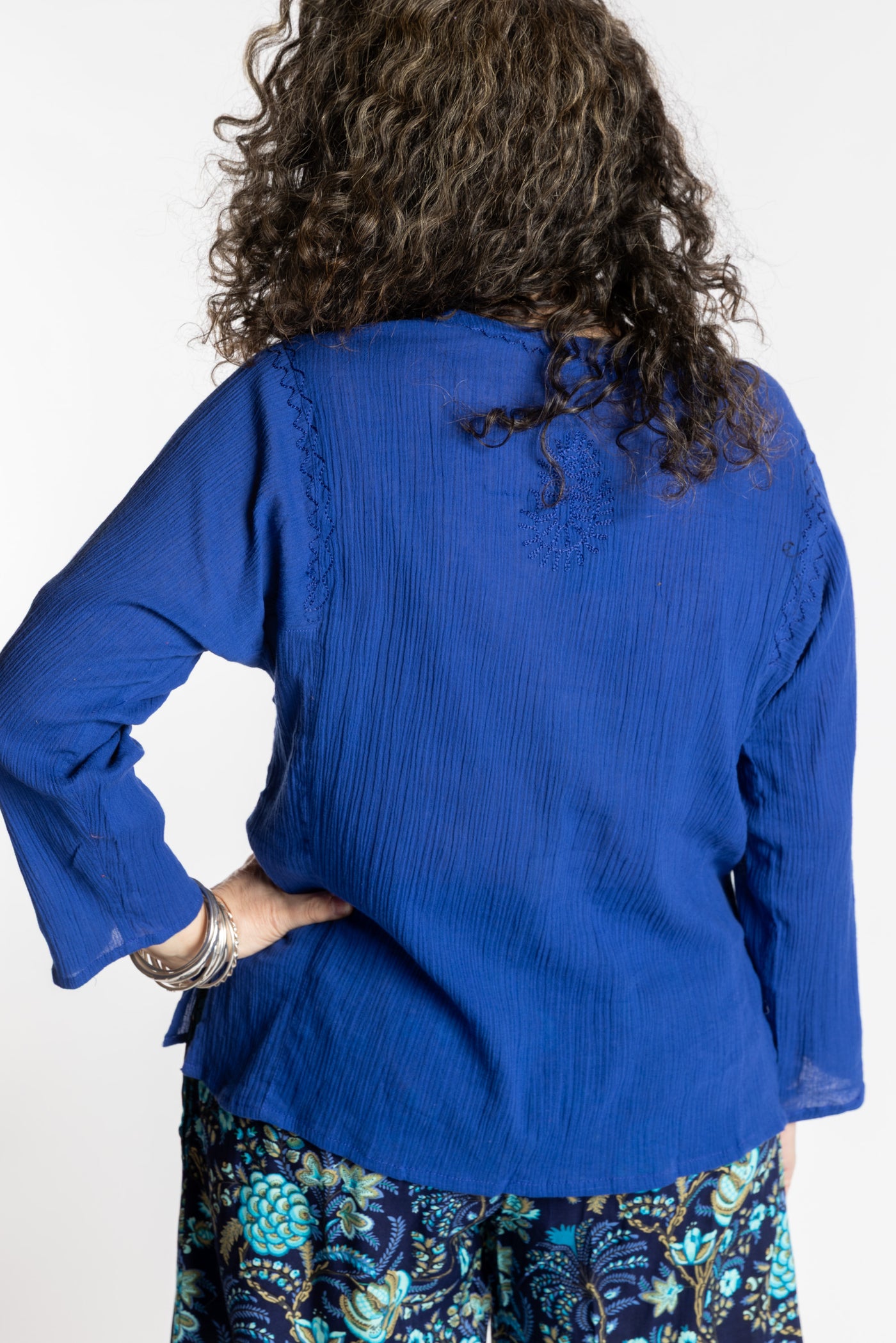 Susan is wearing the M Blue Flowy Bohemian Womens Clothing Top