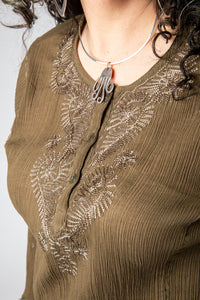 Susan is wearing size M cotton kurta in olive