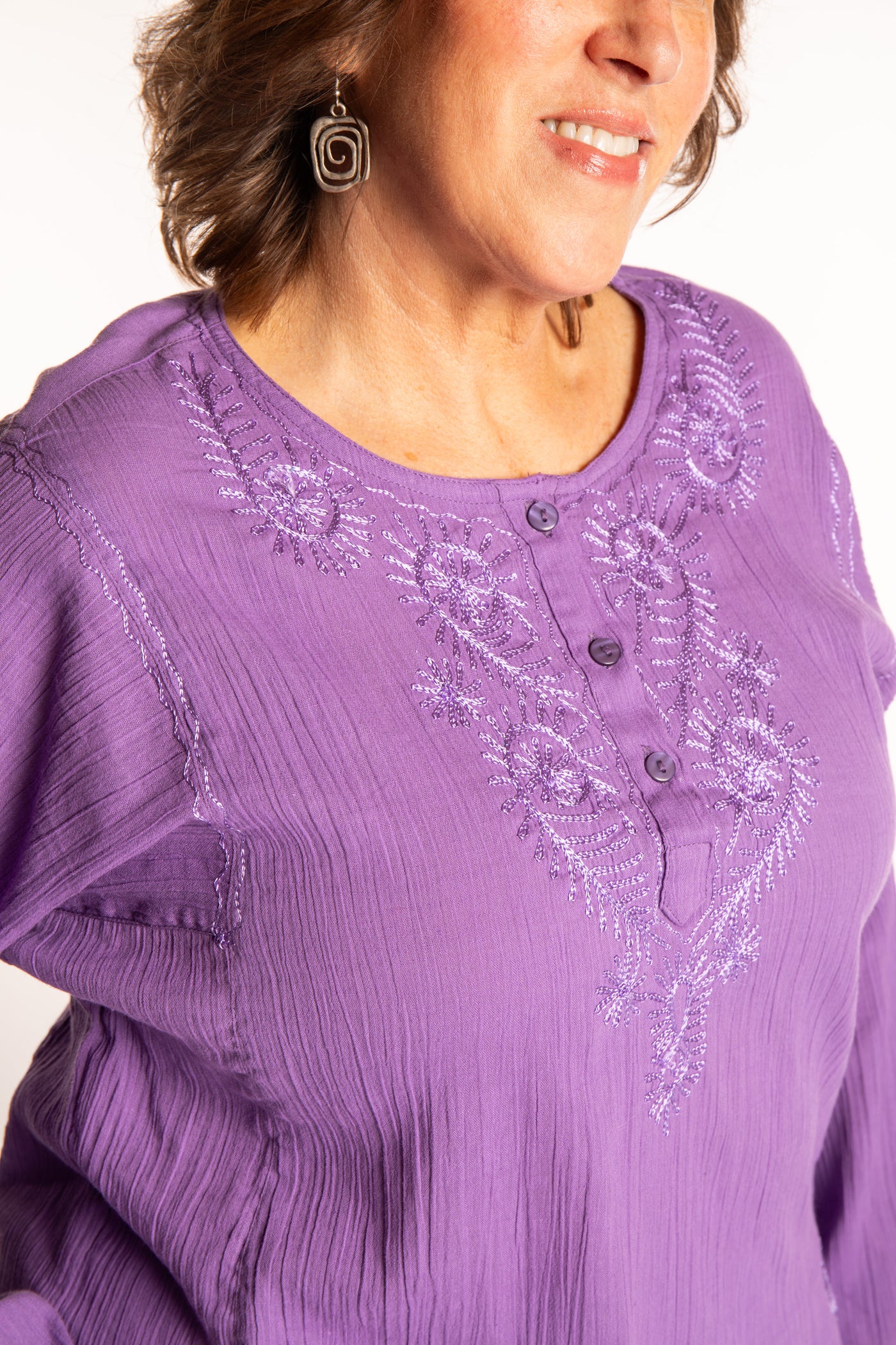 Betty is wearing a size L Purple embroidered Kurta top