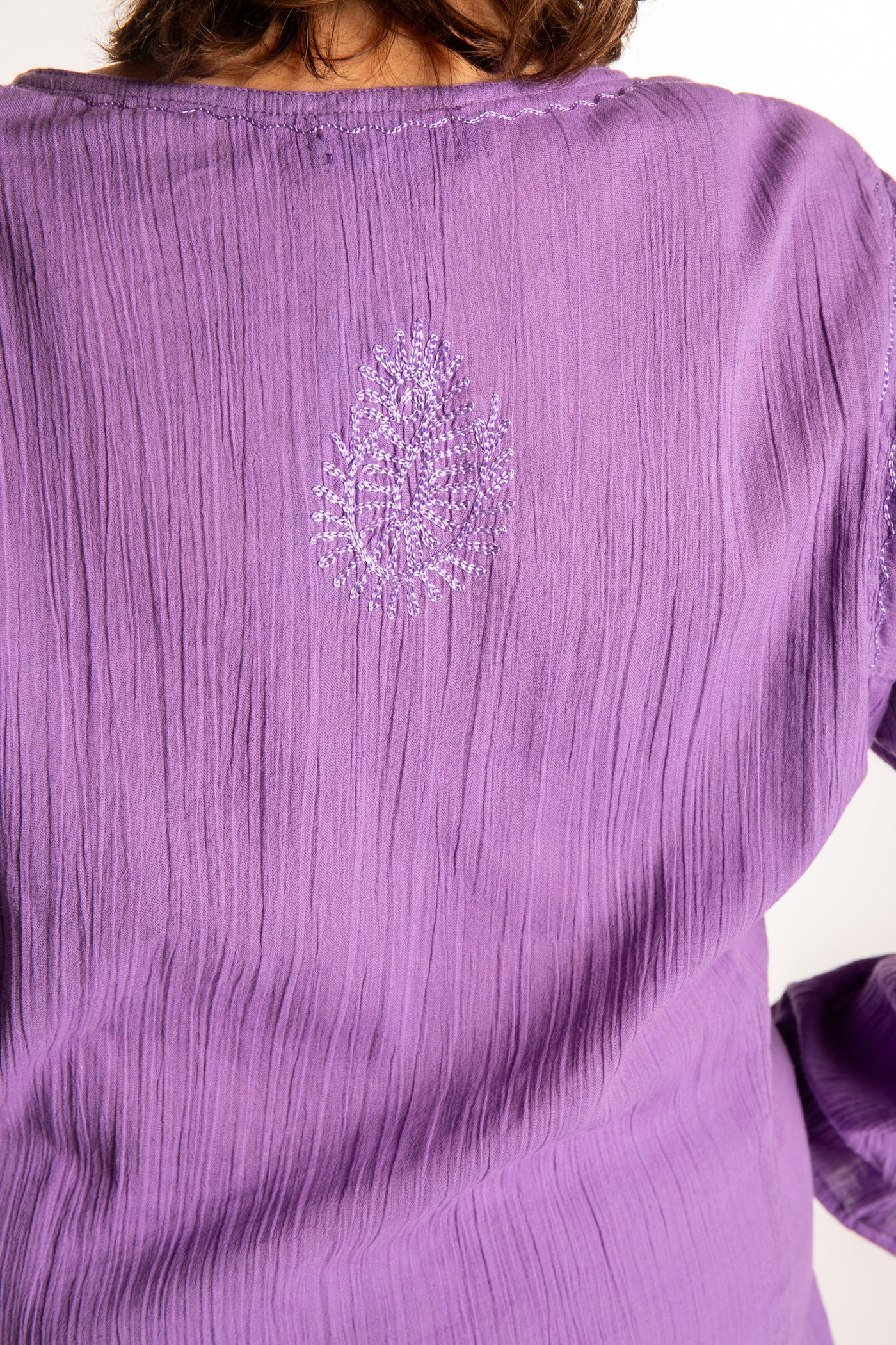 Betty is wearing a size L Purple embroidered Kurta top
