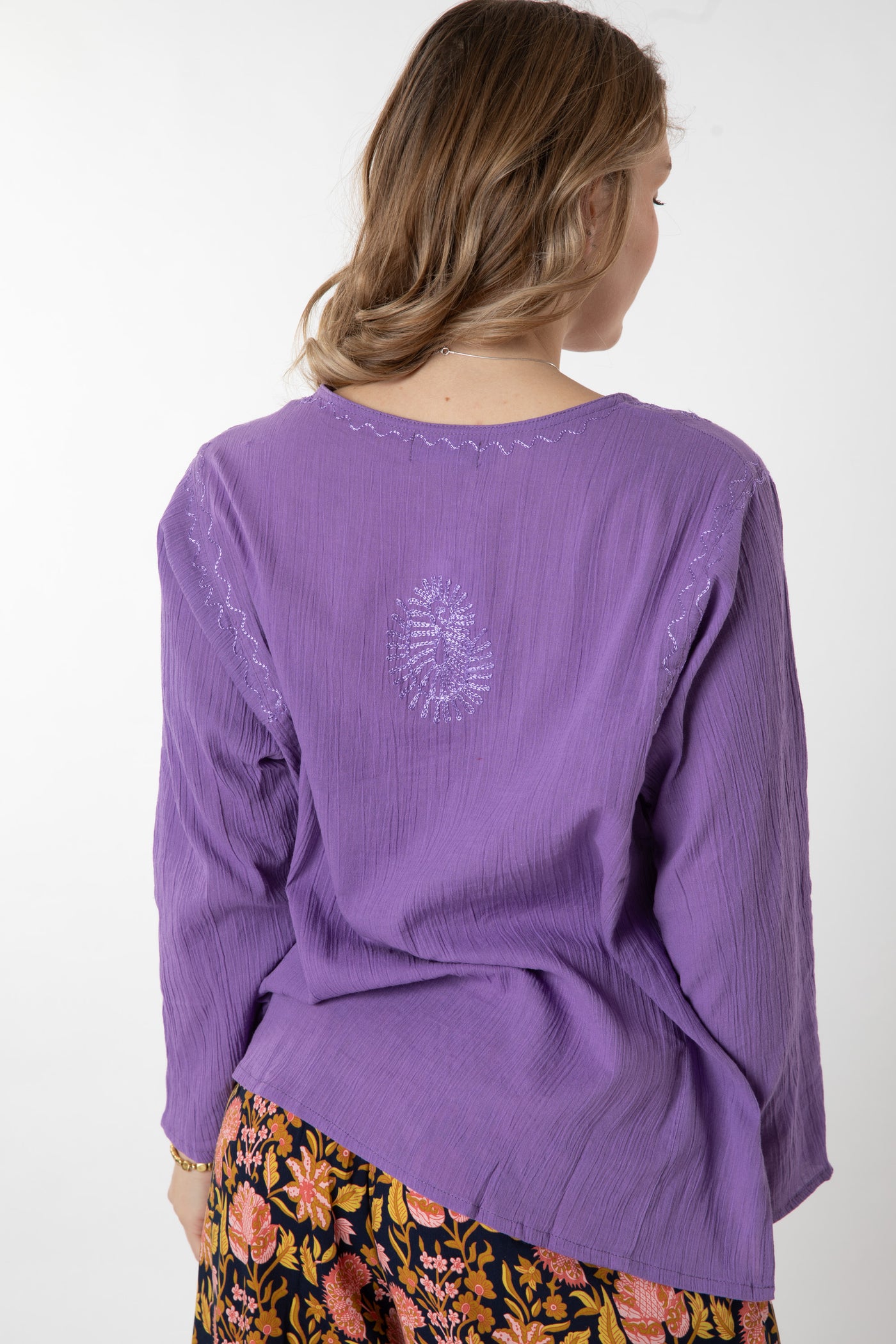 Jacalyn is wearing size S cotton kurta in purple