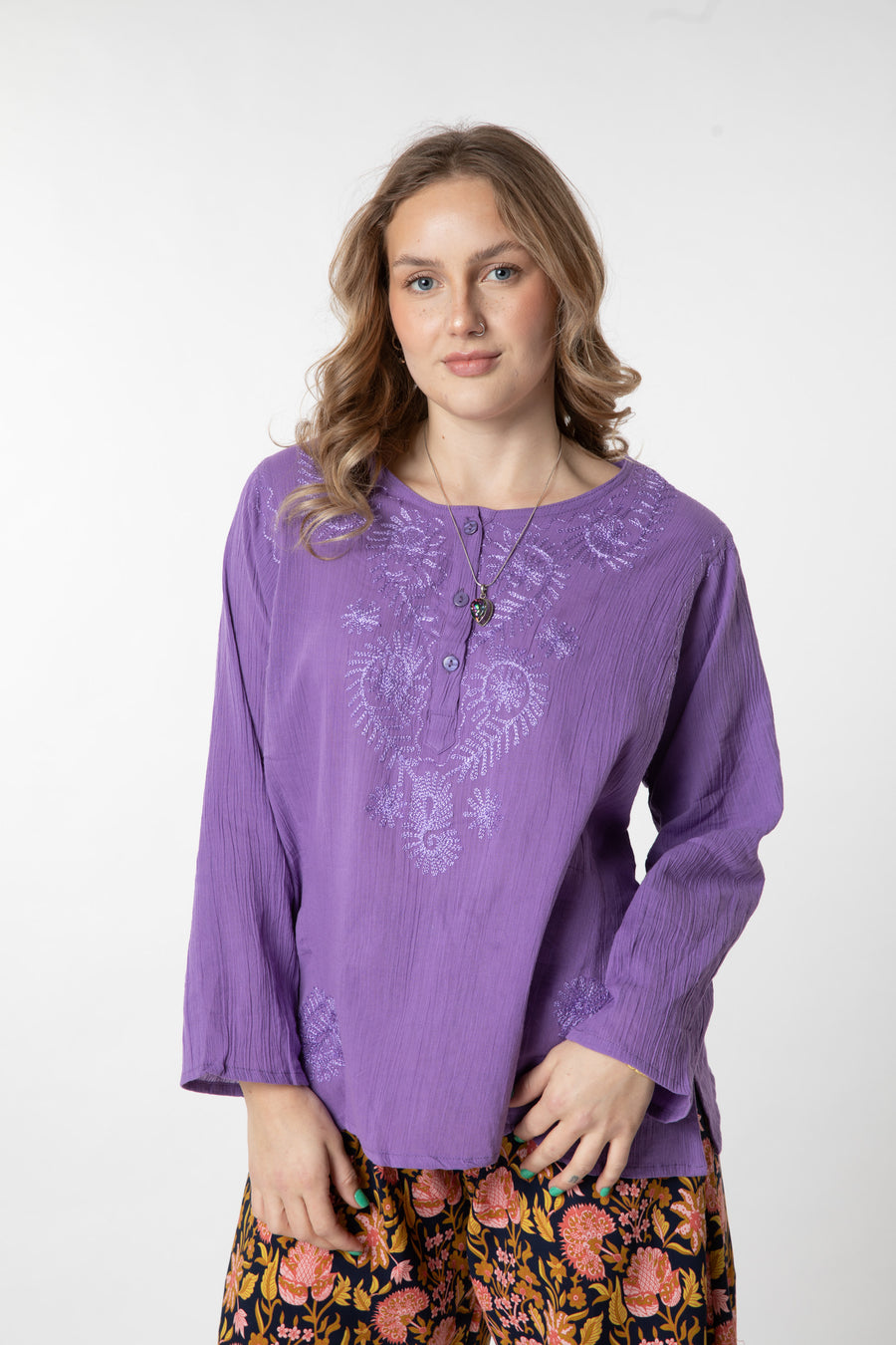 Jacalyn is wearing size S cotton kurta in purple