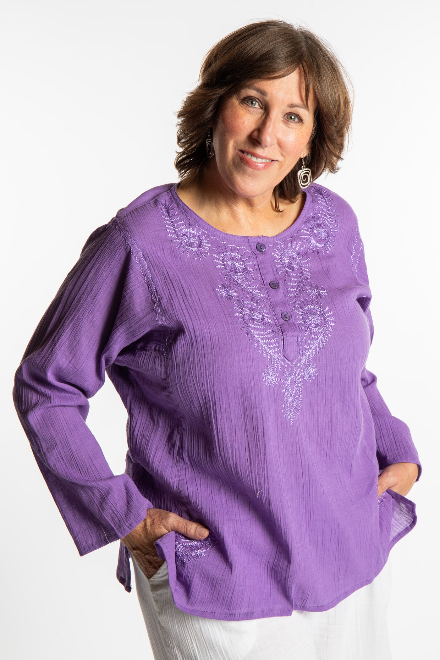 Betty is wearing a size L Purple embroidered Kurta top