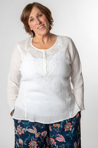 Betty is wearing size M cotton kurta in white