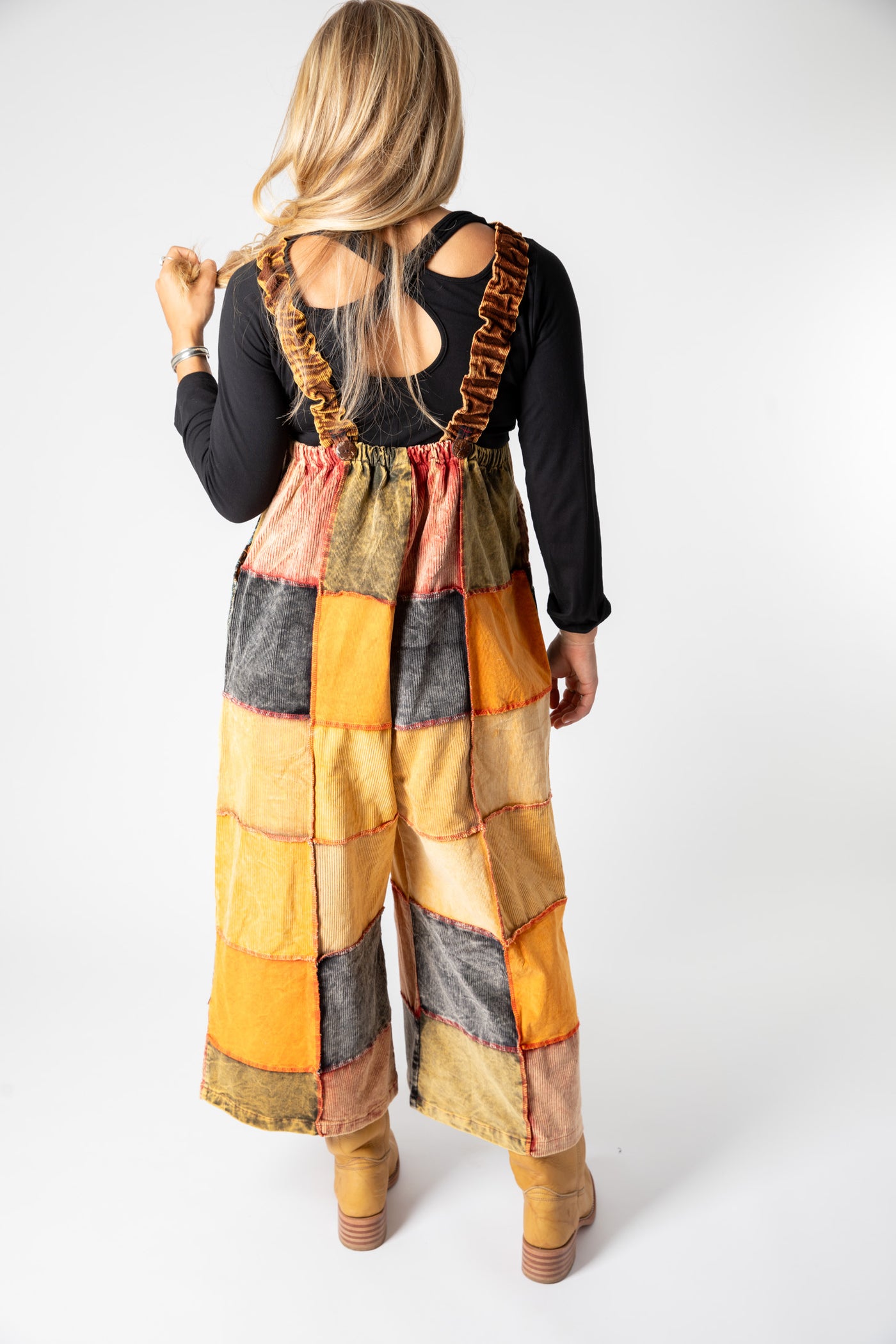 Sophie is wearing size S/M patchwork corduroy jumper in terracotta