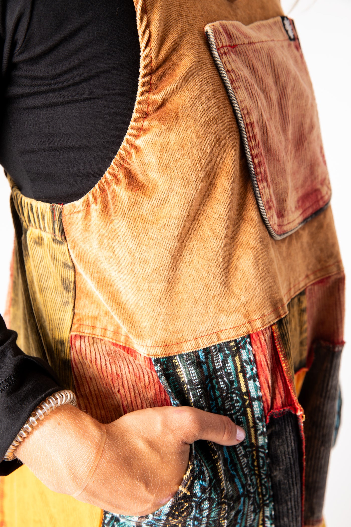 Sophie is wearing size S/M patchwork corduroy jumper in terracotta