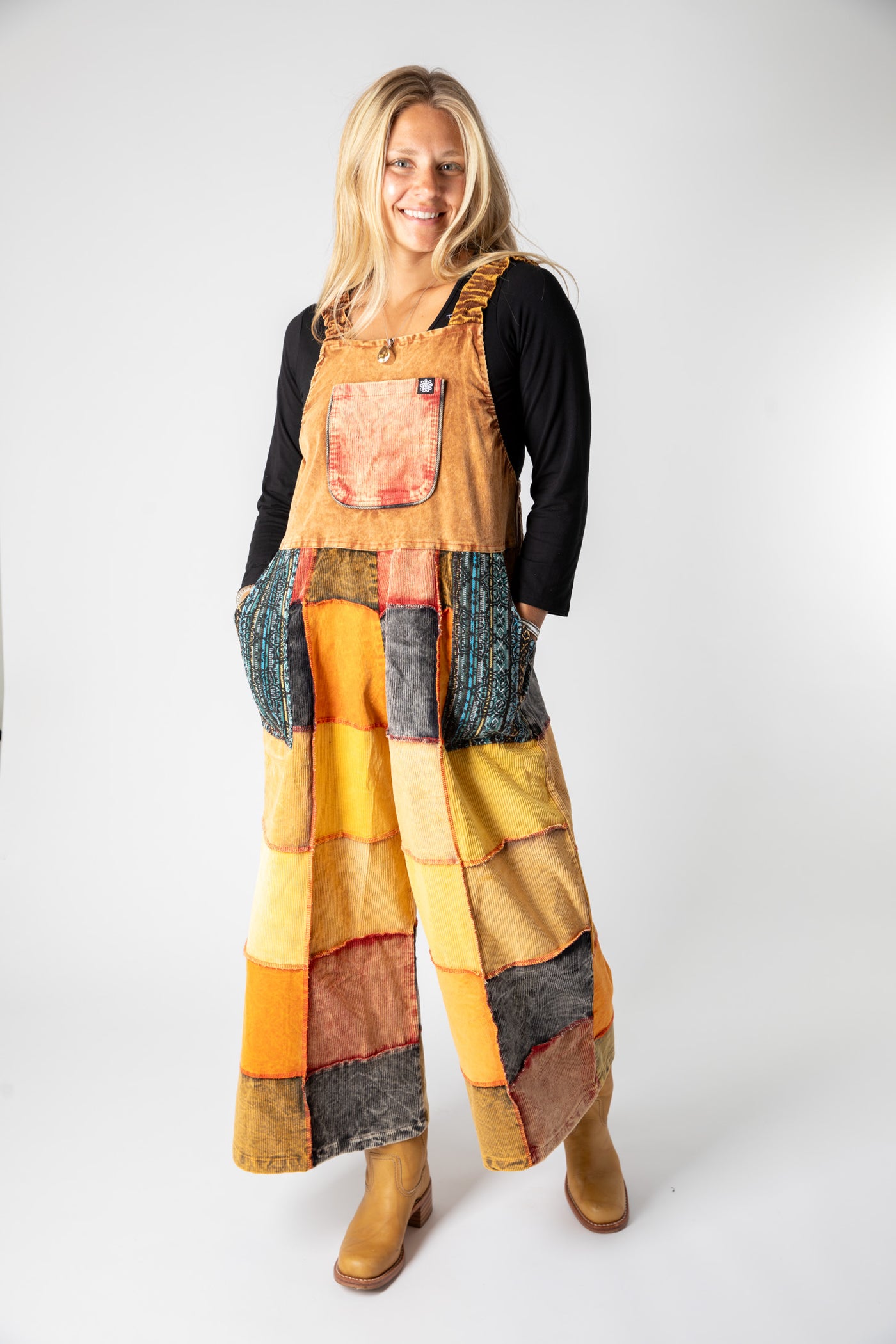 Sophie is wearing size S/M patchwork corduroy jumper in terracotta