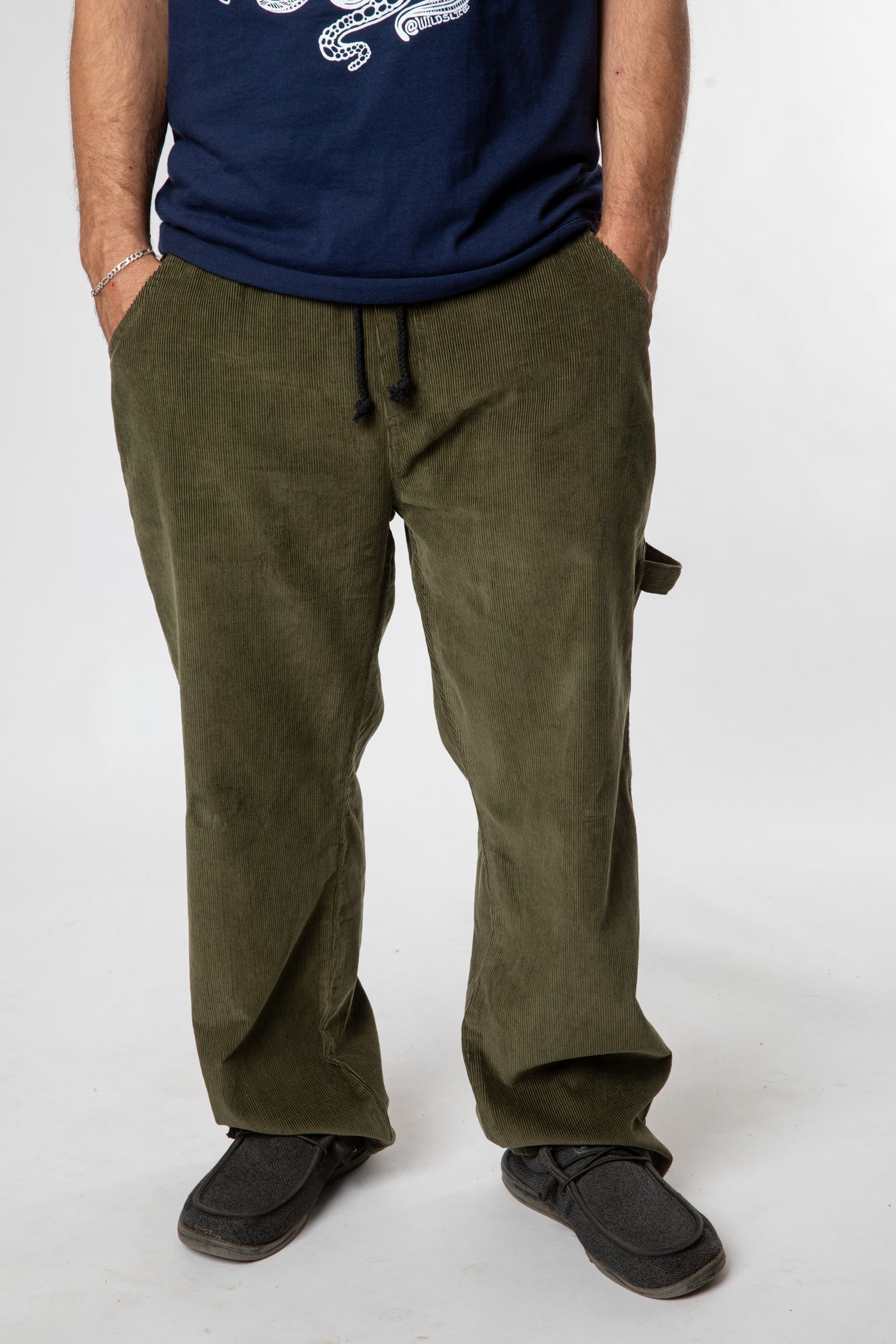 Harvey is wearing M in green