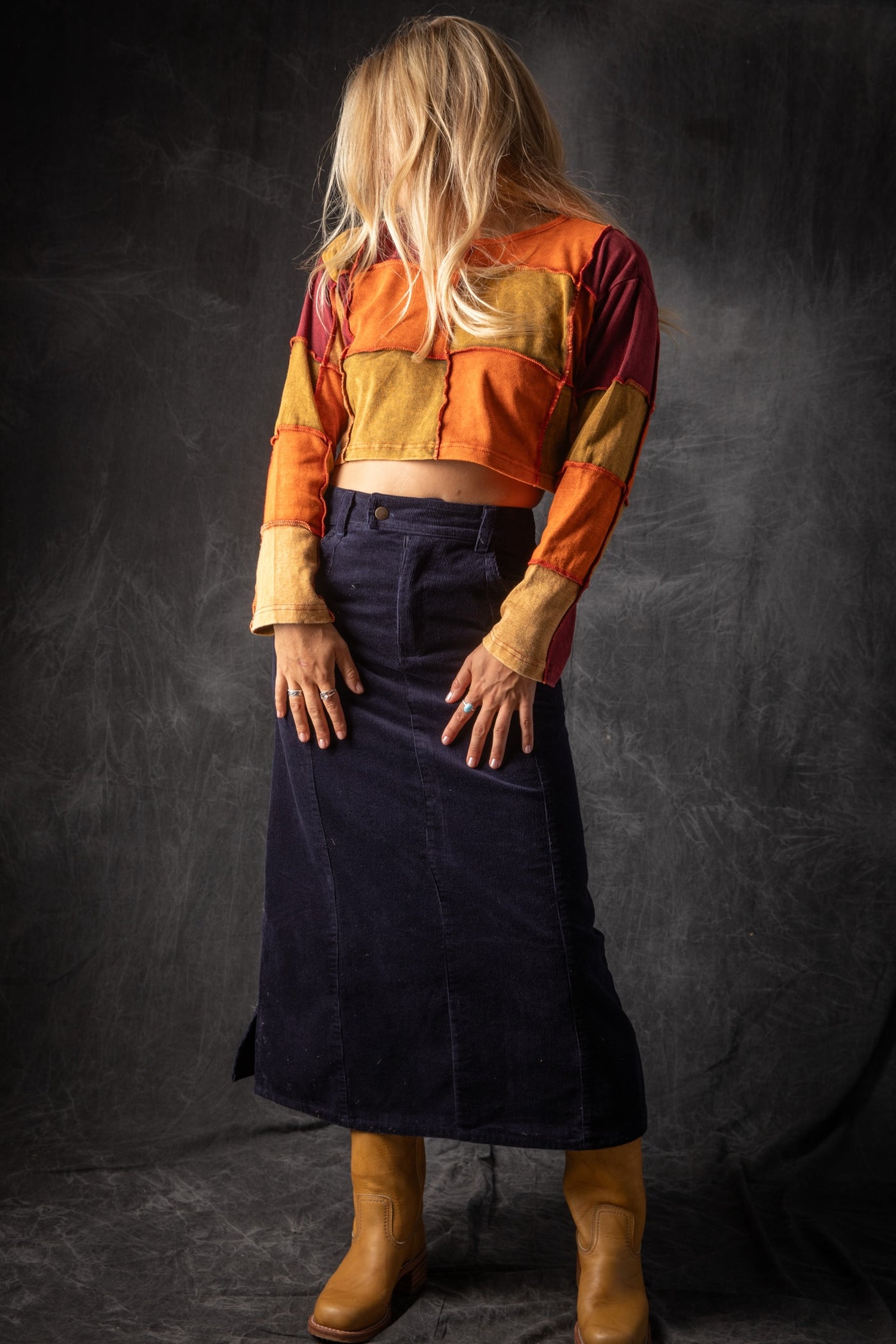 Sophie is wearing size S corduroy skirt in navy