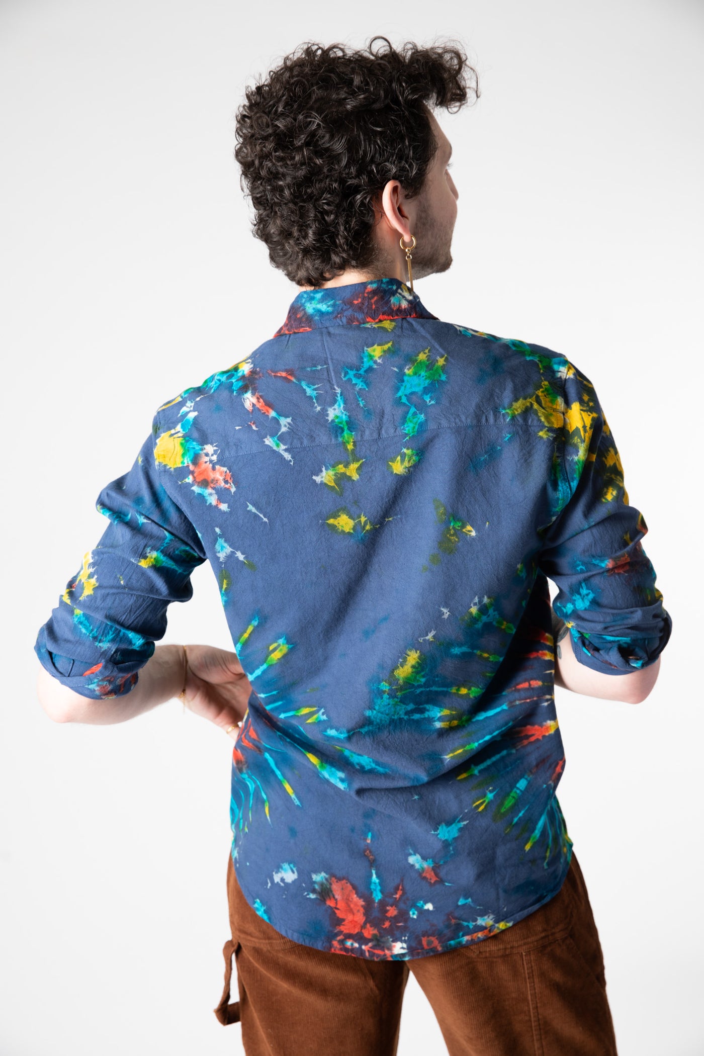 Dimitri is wearing size L tie dye button up shirt in blue
