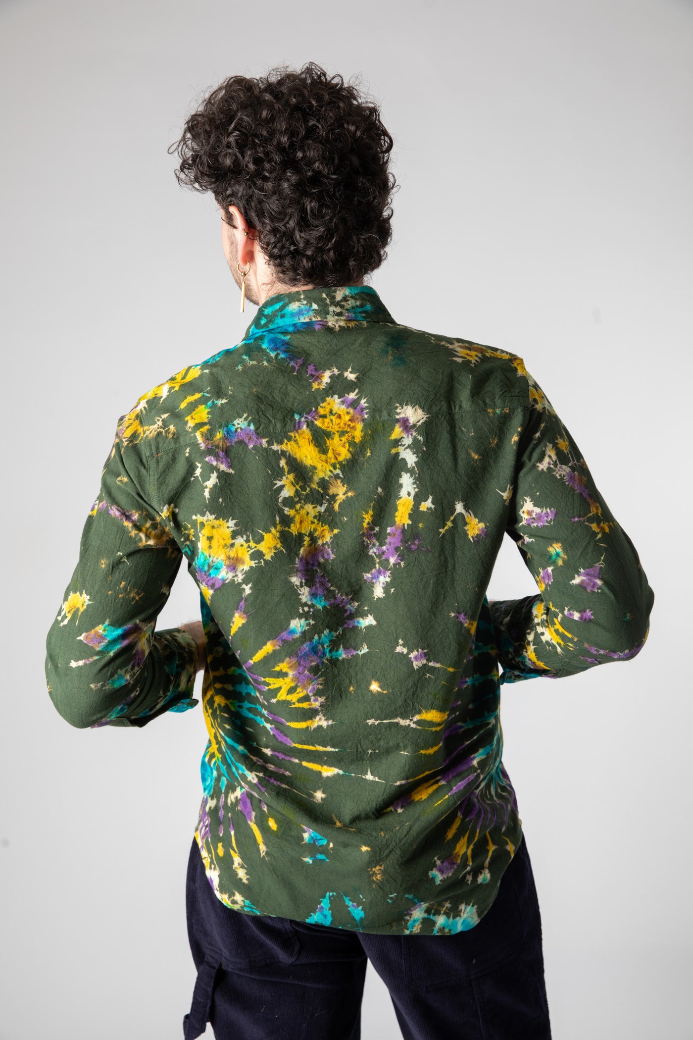 Dimitri is wearing size L tie dye button up shirt in green