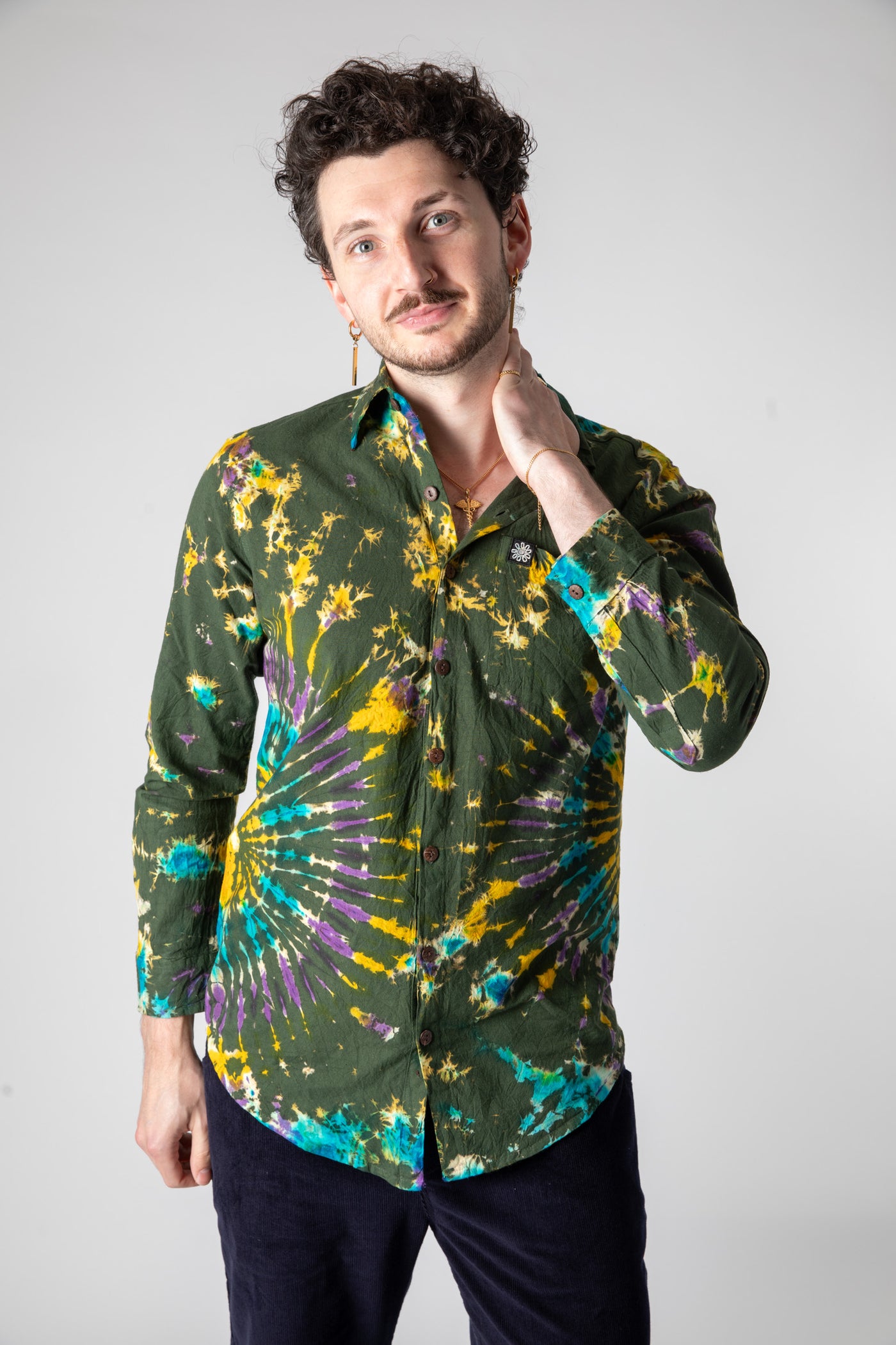 Dimitri is wearing size L tie dye button up shirt in green