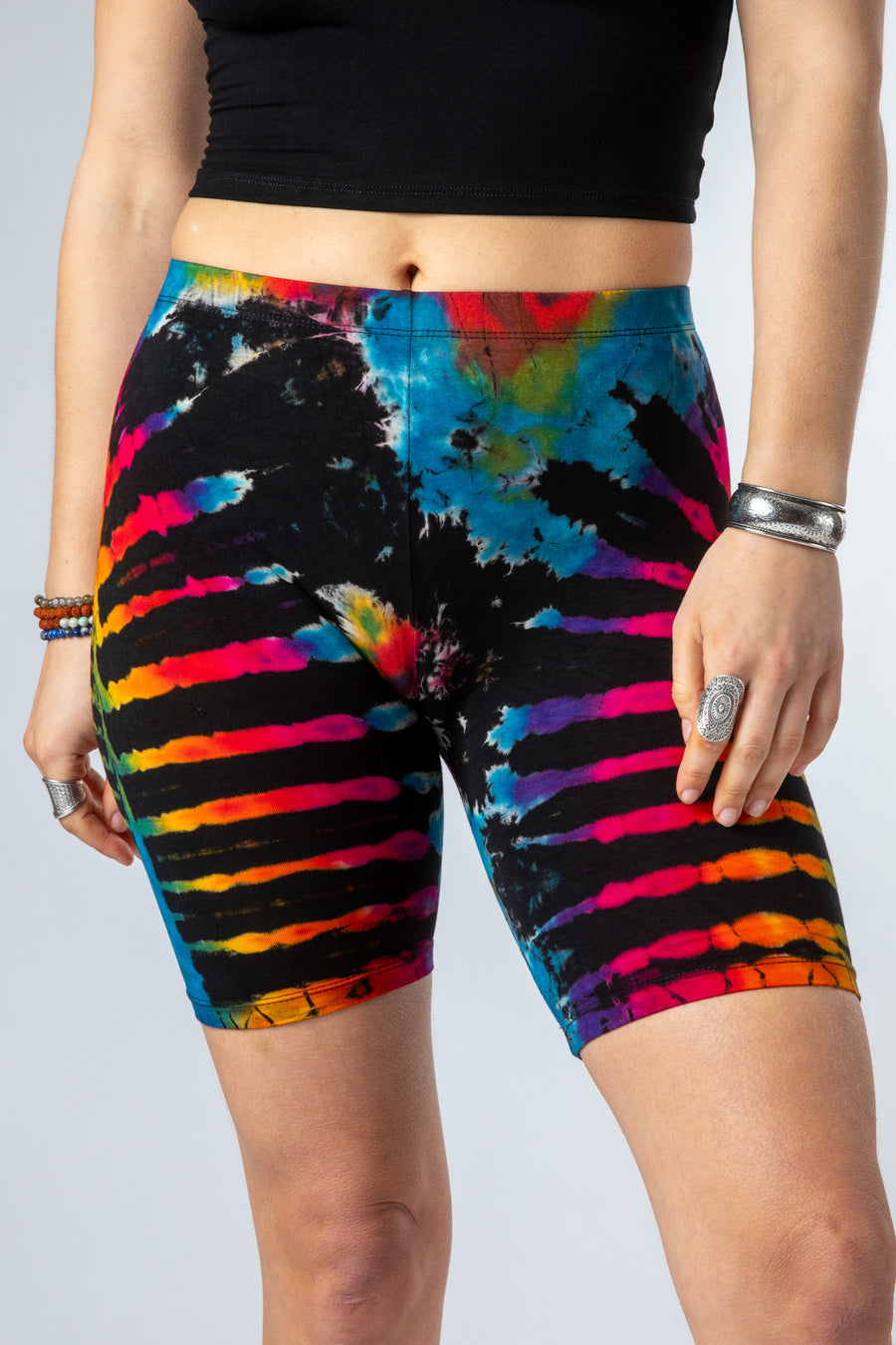 Sophie is wearing size S/M tie dye bike shorts in black rainbow 