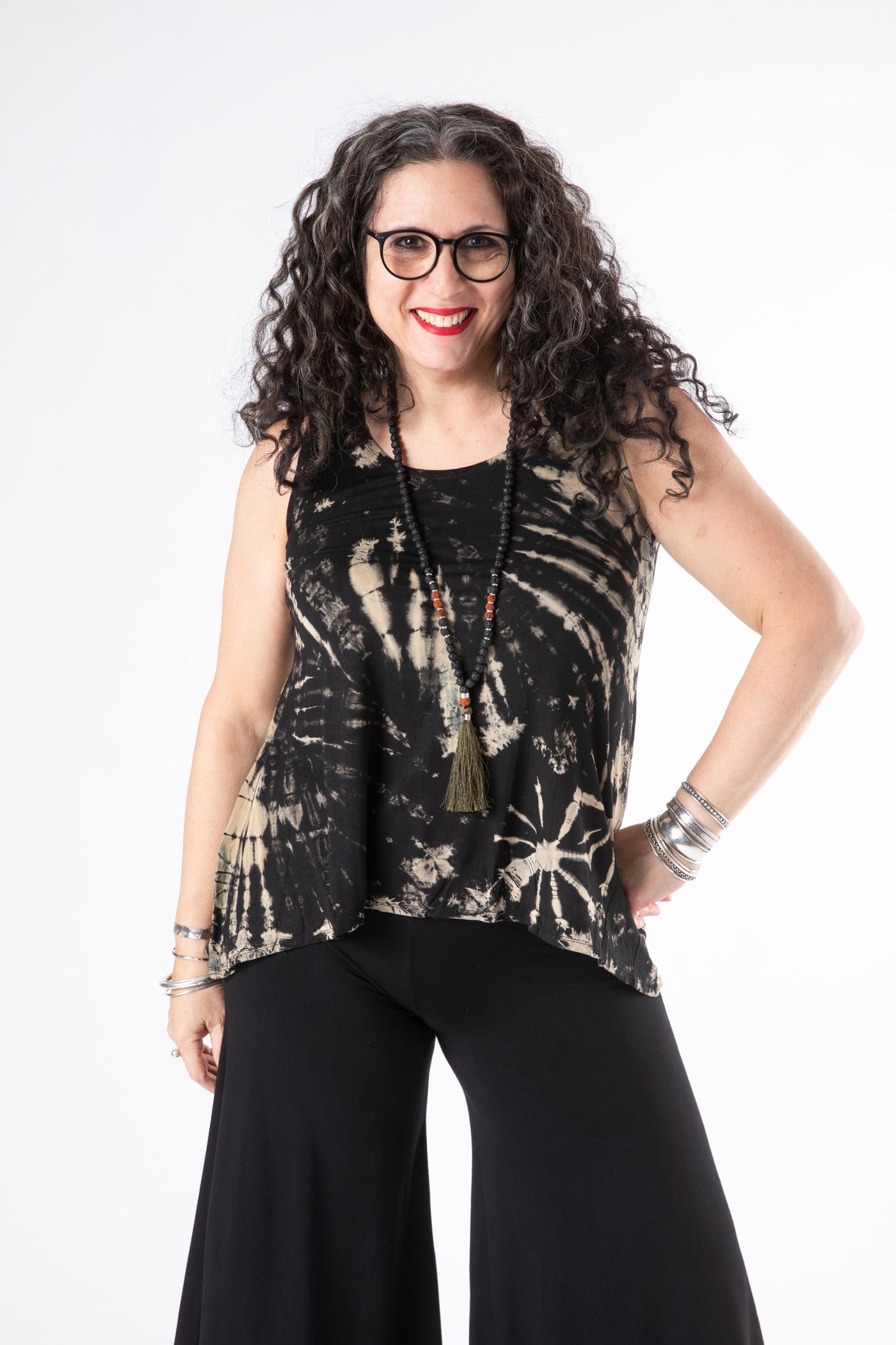Susan is wearing a tie dye tank top in black and white