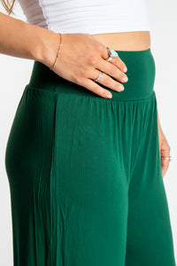 Sophie is wearing size S/M lounge pants in Green