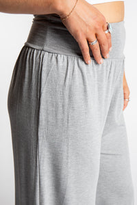 Sophie is wearing size S/M lounge pants in Light Gray