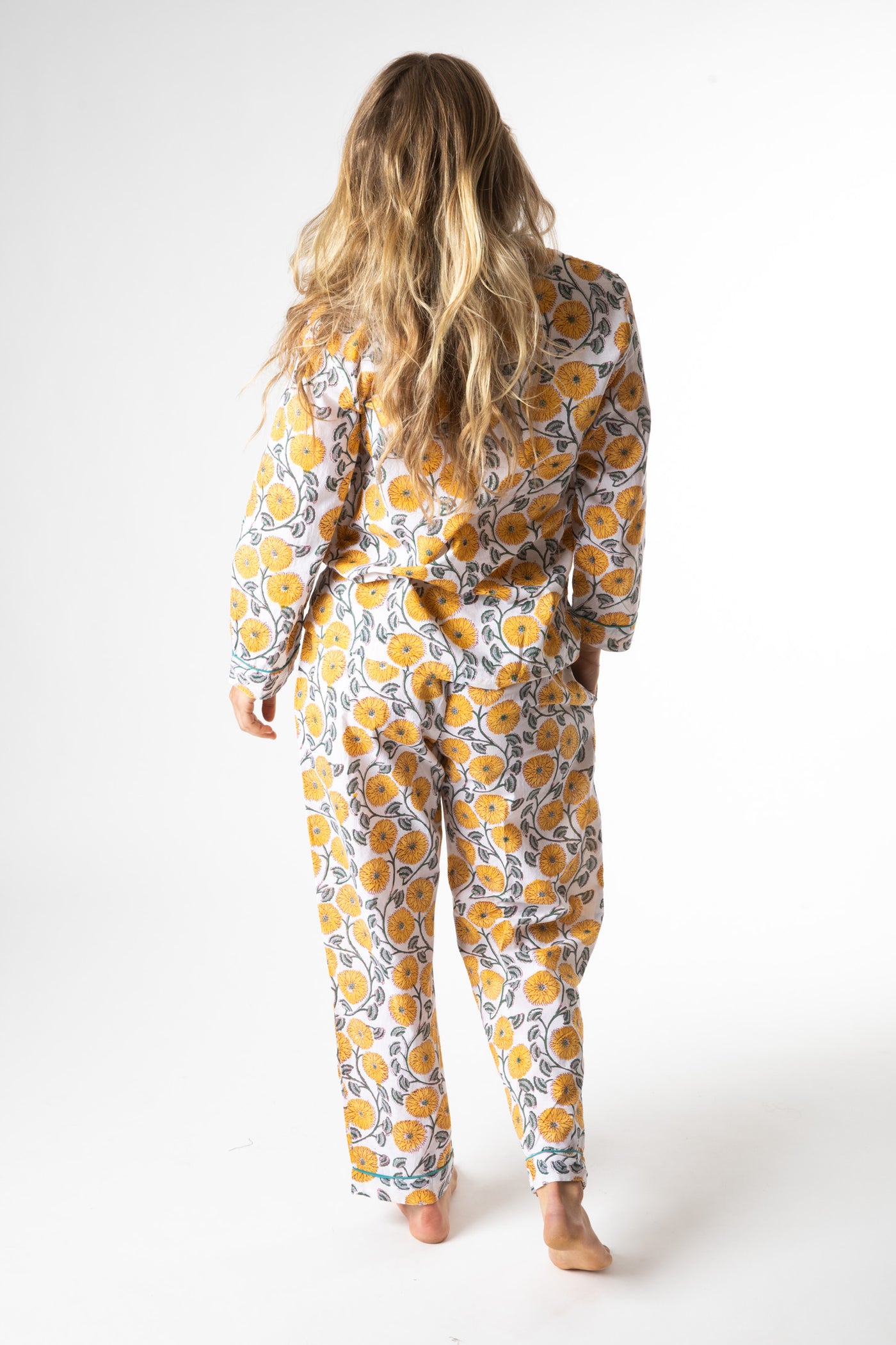 Sophie is wearing size M pajama set in dandelion