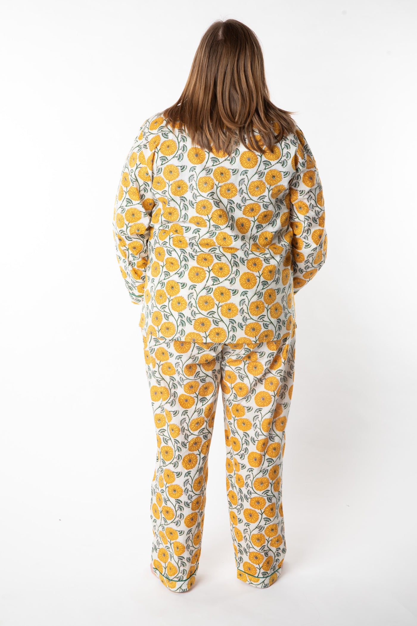 Olivia is wearing size XL pajama set in dandelion