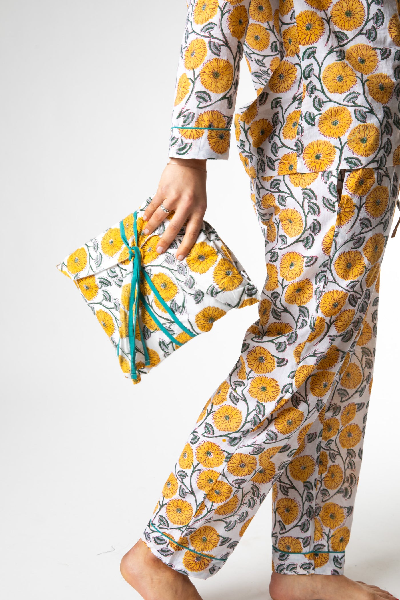 Sophie is wearing size M pajama set in dandelion