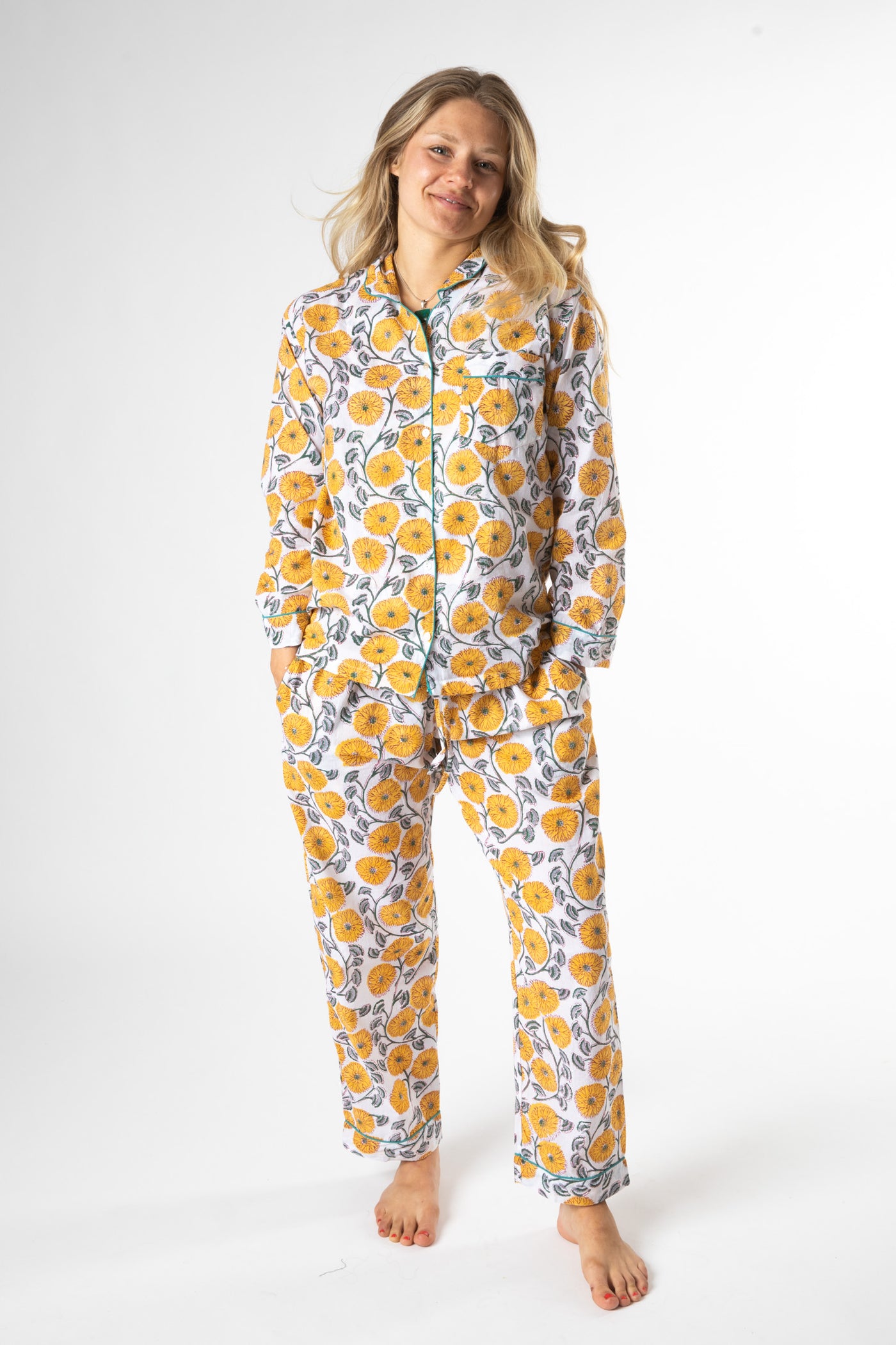 Sophie is wearing size M pajama set in dandelion