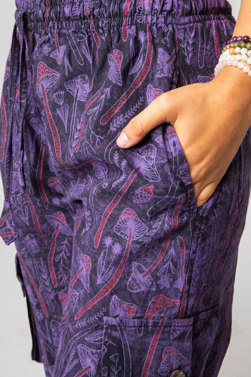 Sophie is wearing size S mushroom pants in purple