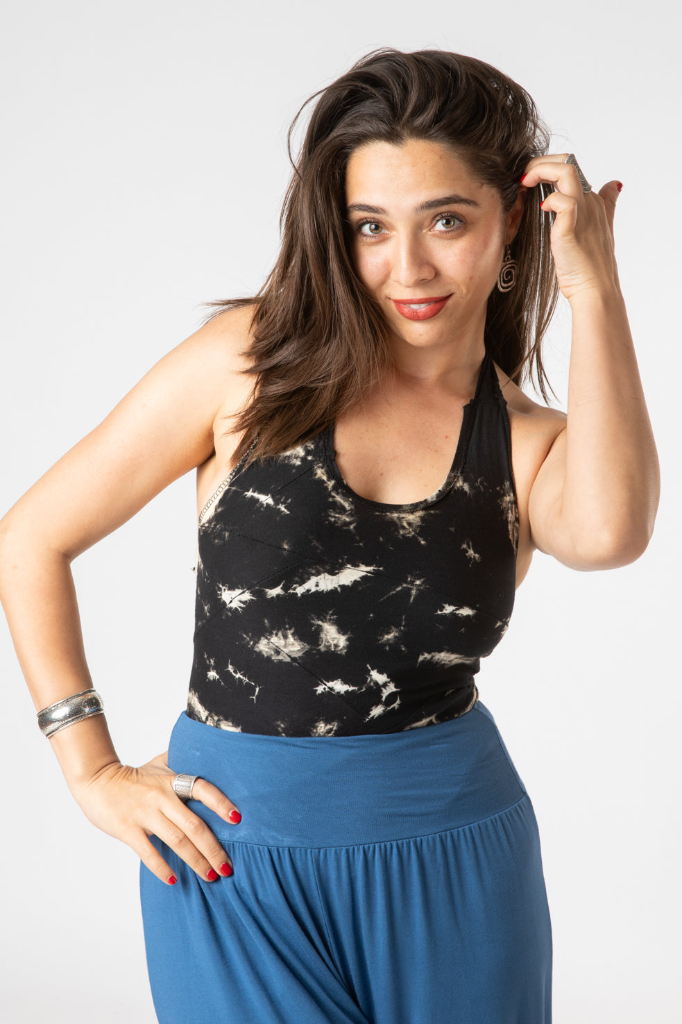 Gabrielle is wearing a tie dye wrap top in black