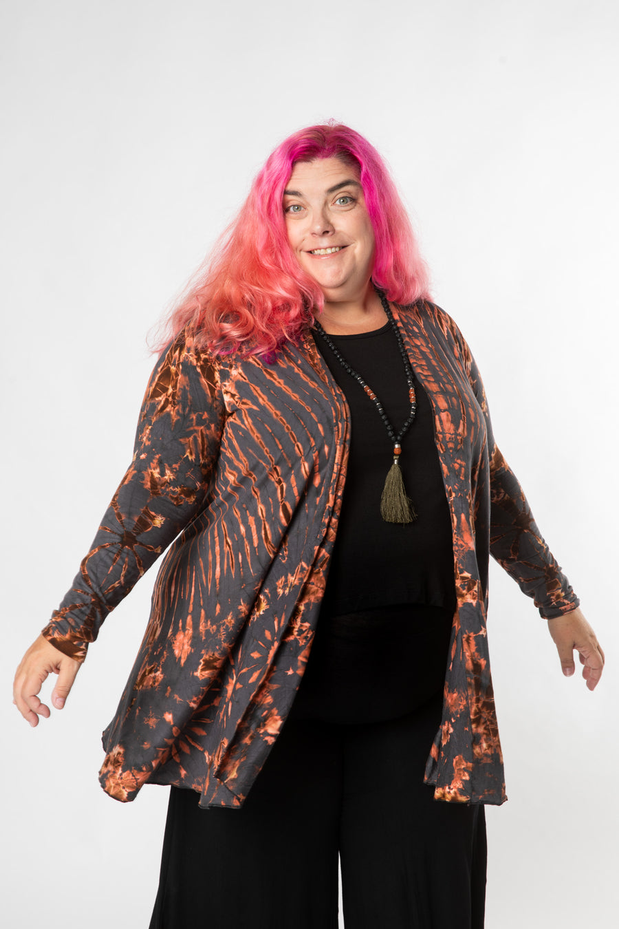 Angel is wearing tie dye cardigan in gray