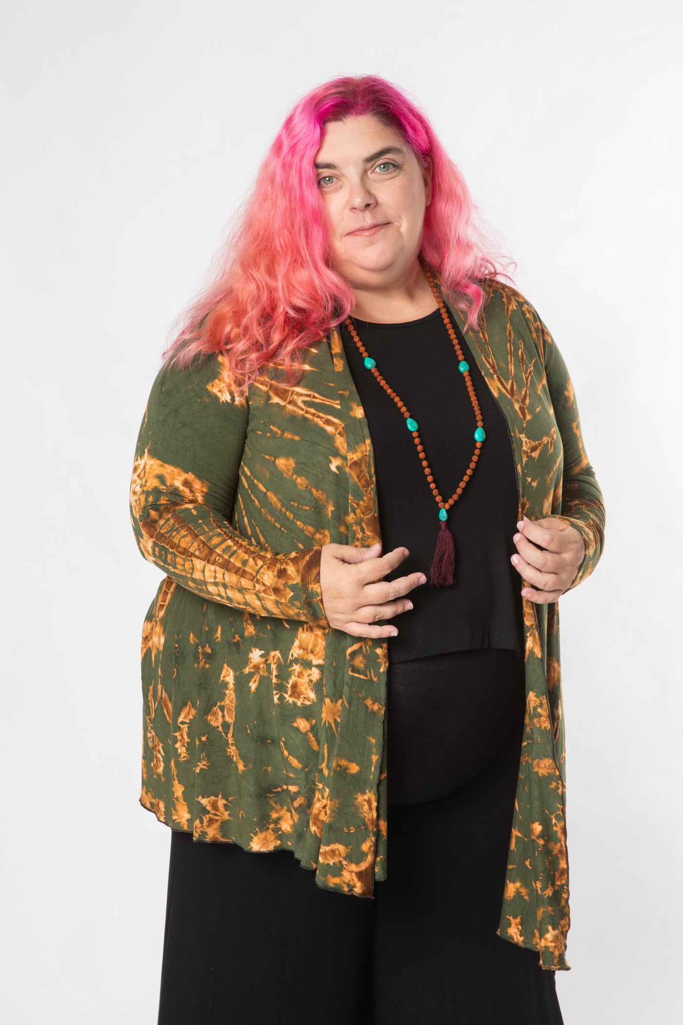 Angel is wearing tie dye cardigan in green