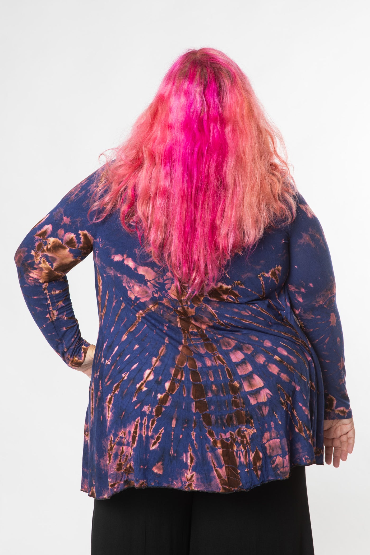 Angel is wearing tie dye cardigan in navy