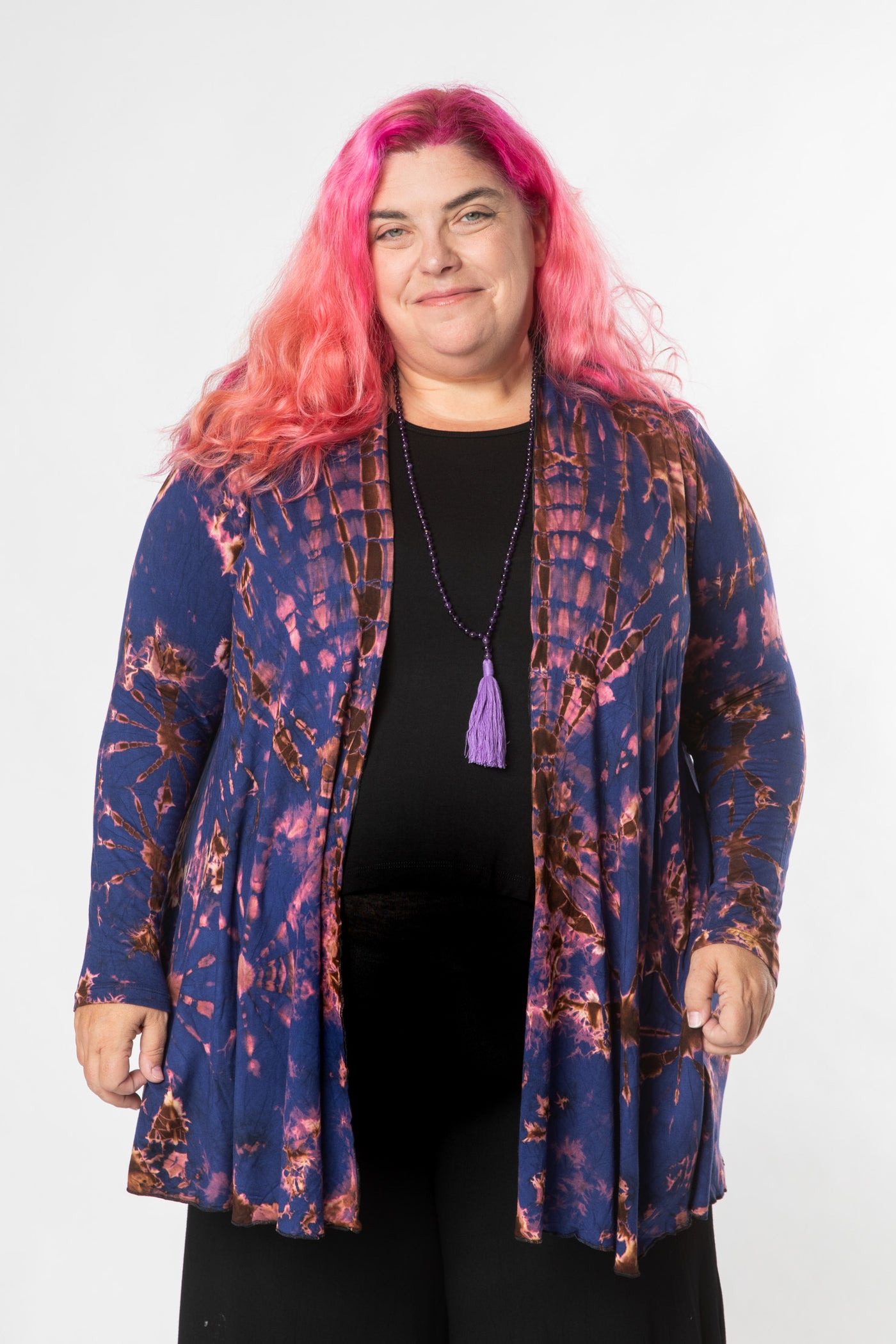 Angel is wearing tie dye cardigan in navy