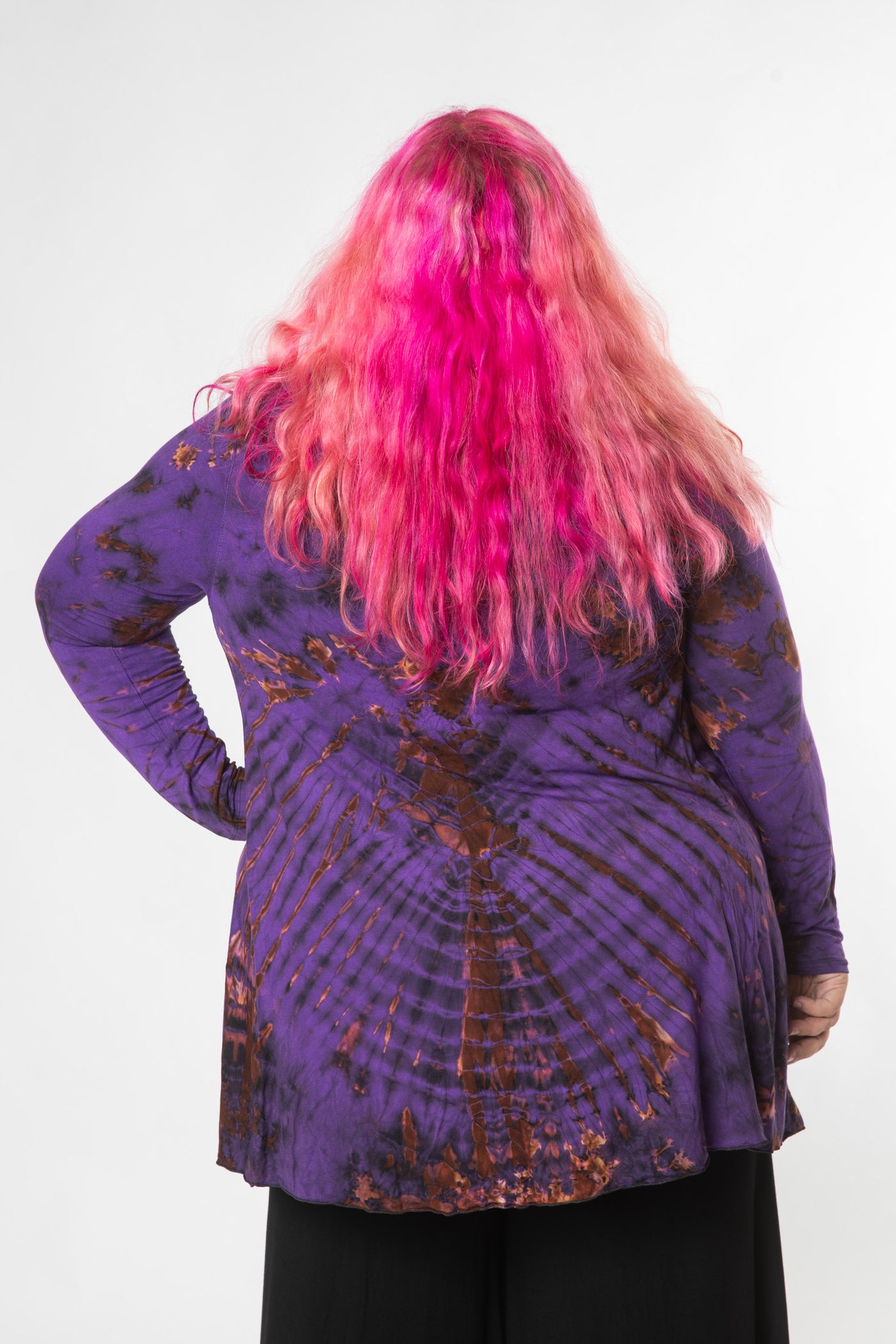 Angel is wearing tie dye cardigan in purple