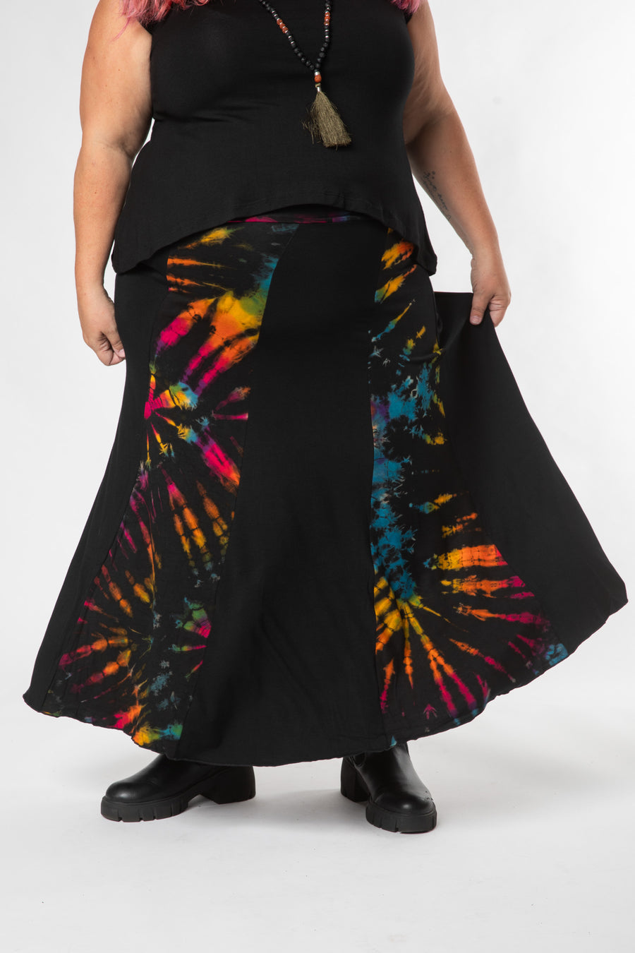 Angel is wearing size L/XL tie dye panel skirt in black rainbow