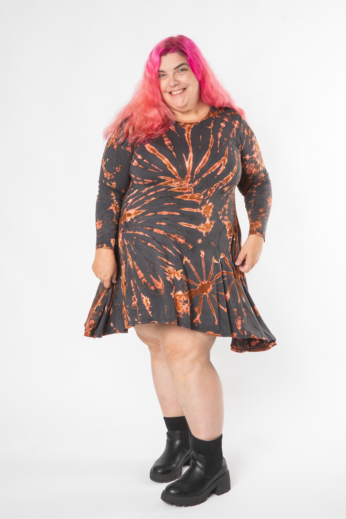 Angel is wearing a long sleeve tie dye dress in gray