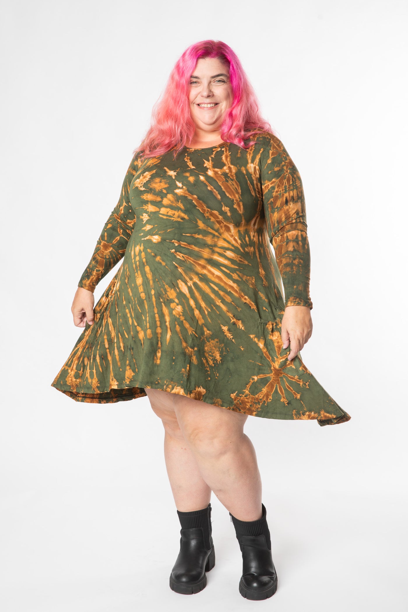 Angel is wearing a long sleeve tie dye dress in green