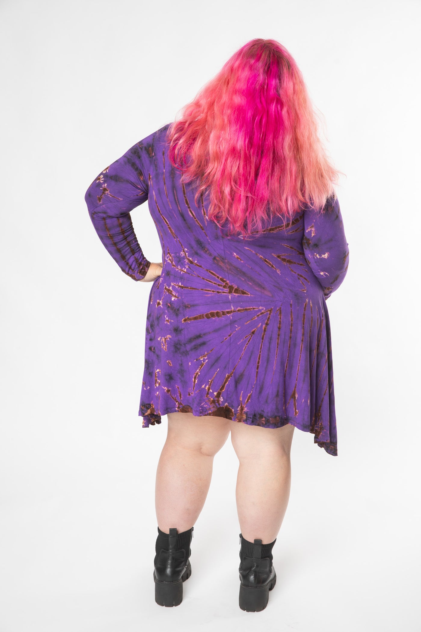 Angel is wearing a long sleeve tie dye dress in purple