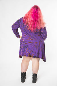 Angel is wearing a long sleeve tie dye dress in purple