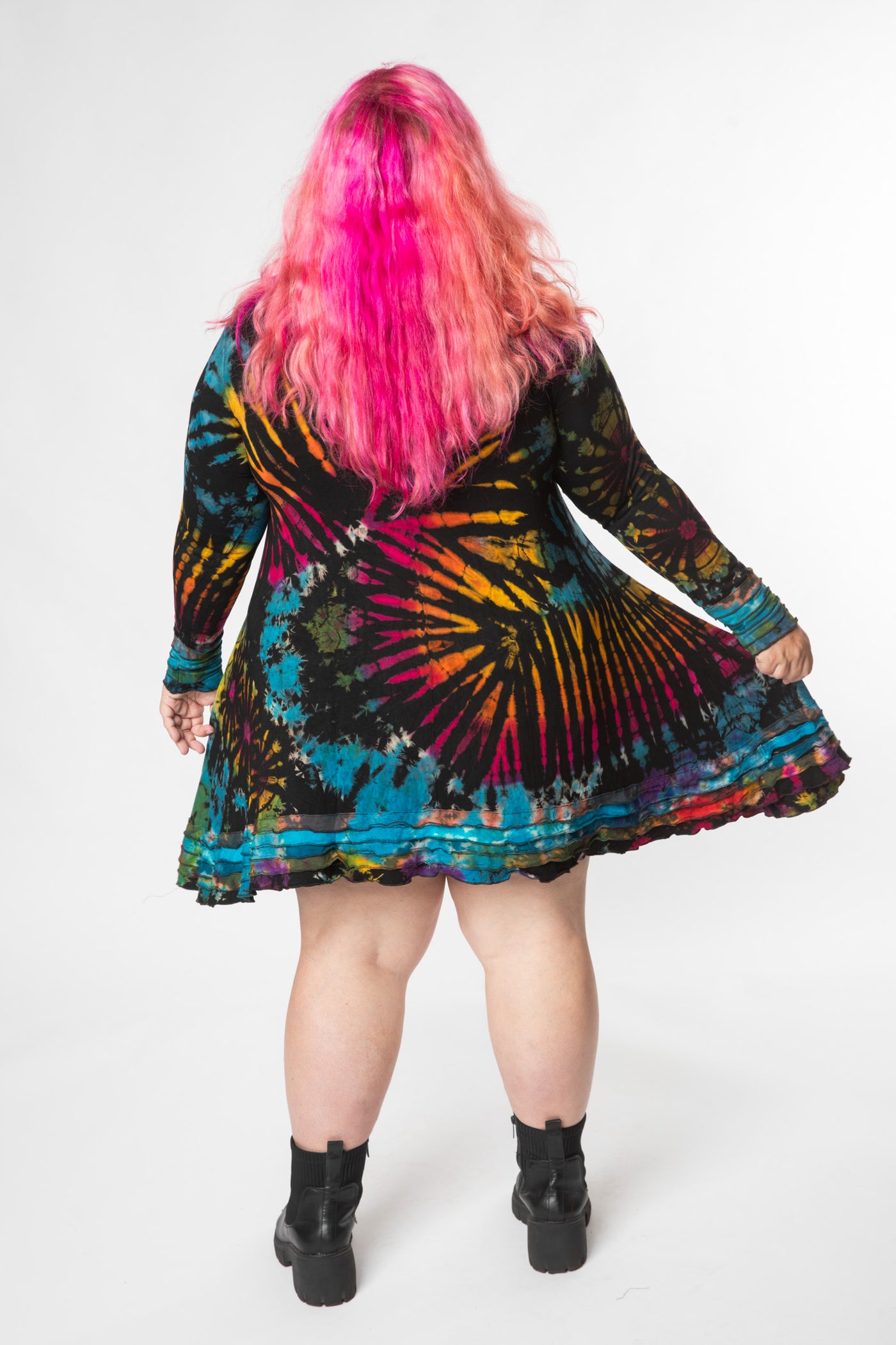 Angel is wearing long sleeve tie dye dress in black rainbow