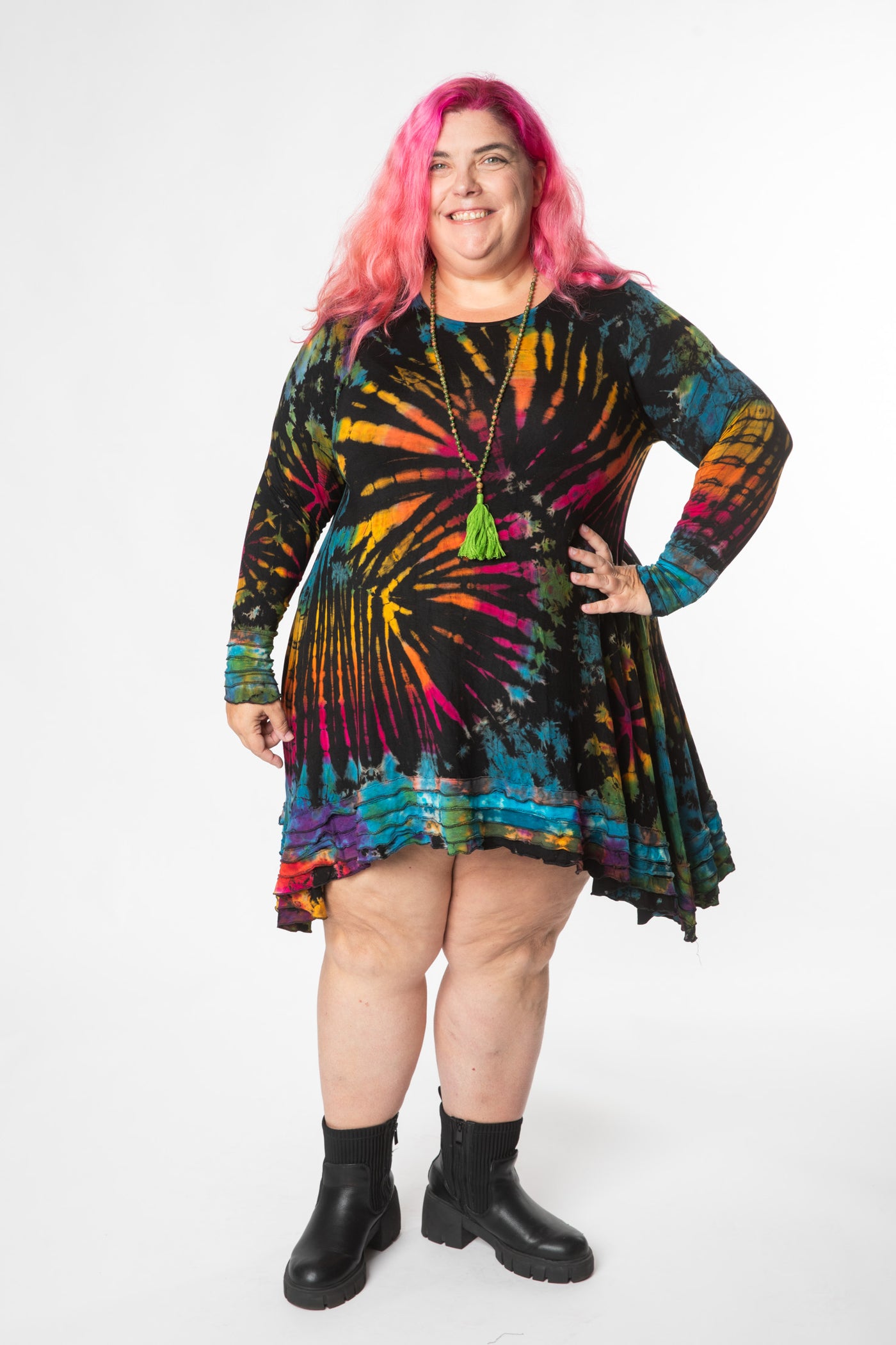 Angel is wearing long sleeve tie dye dress in black rainbow