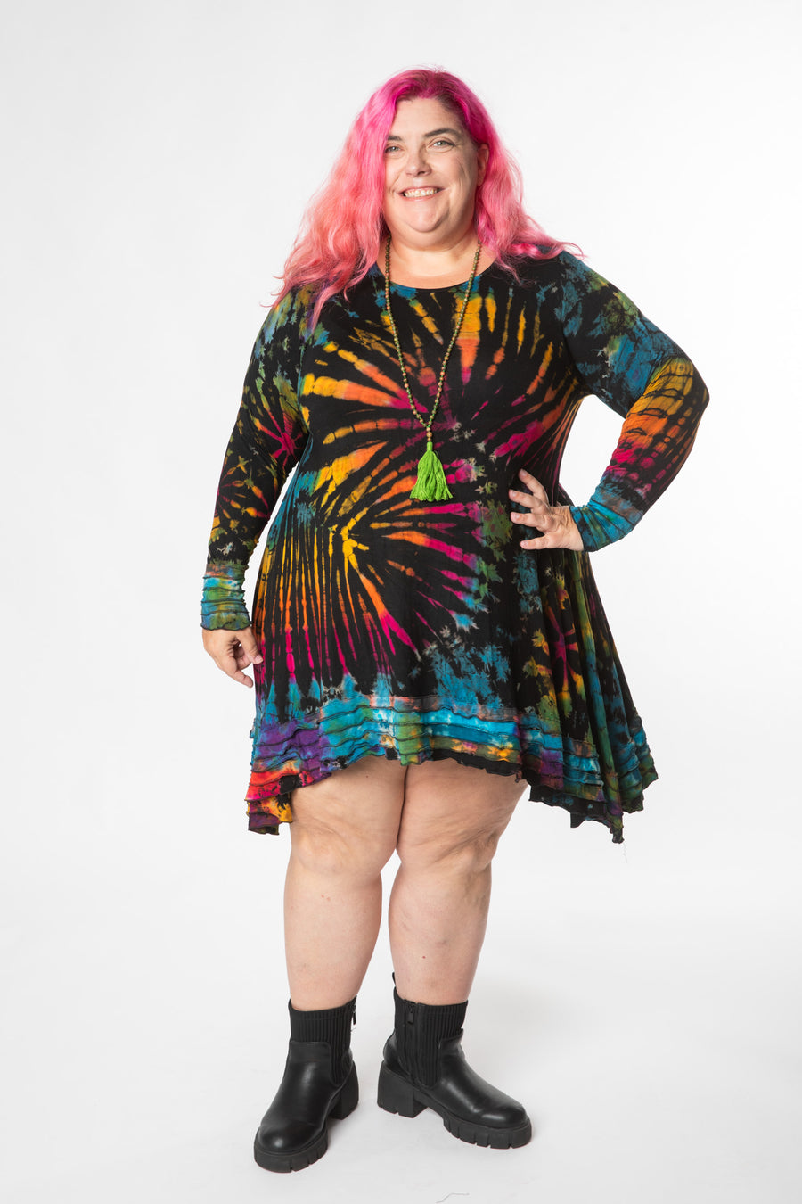 Angel is wearing long sleeve tie dye dress in black rainbow